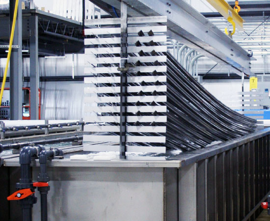 Anodizing process with silver metal dipped in solution in large silver tank